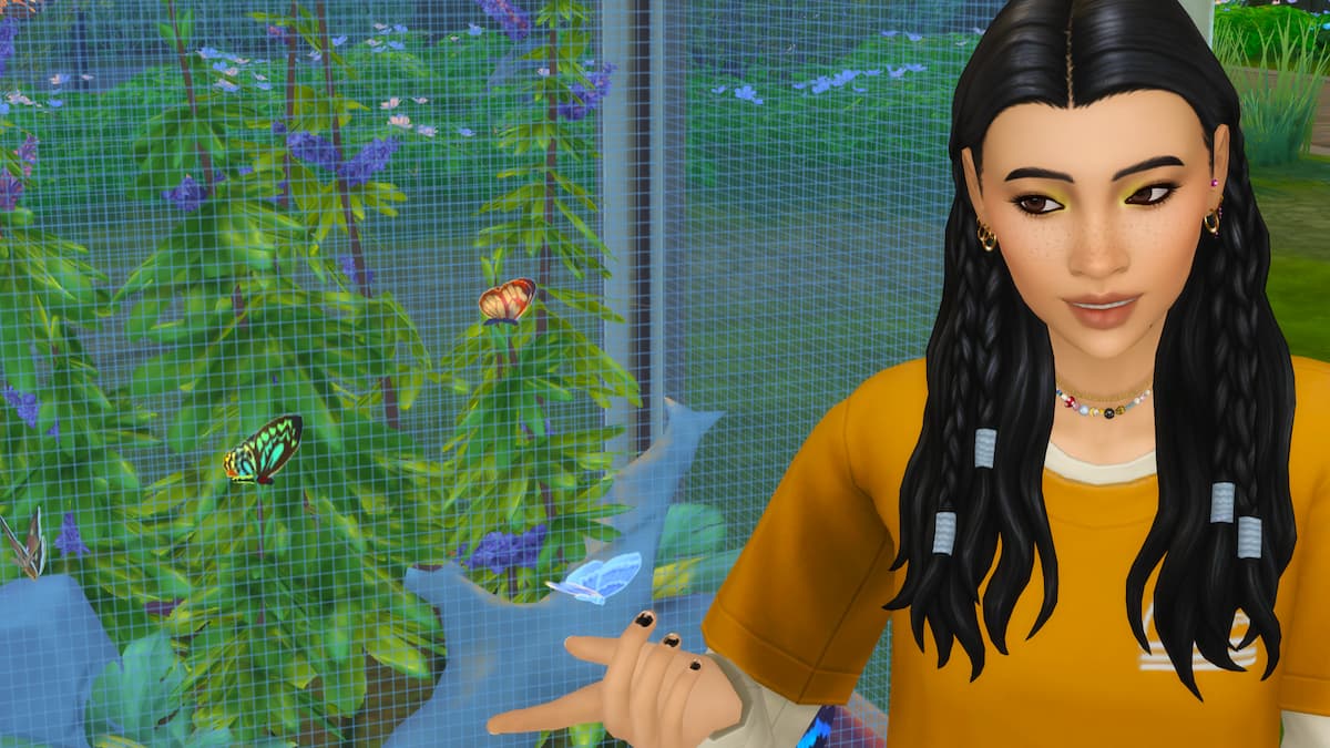 A sim with black hair and a yellow shirt smiling in front of a butterfly and moth habitat in the sims 4