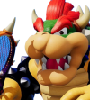 Bowser, A giant dinosaur-like creature with red hair.